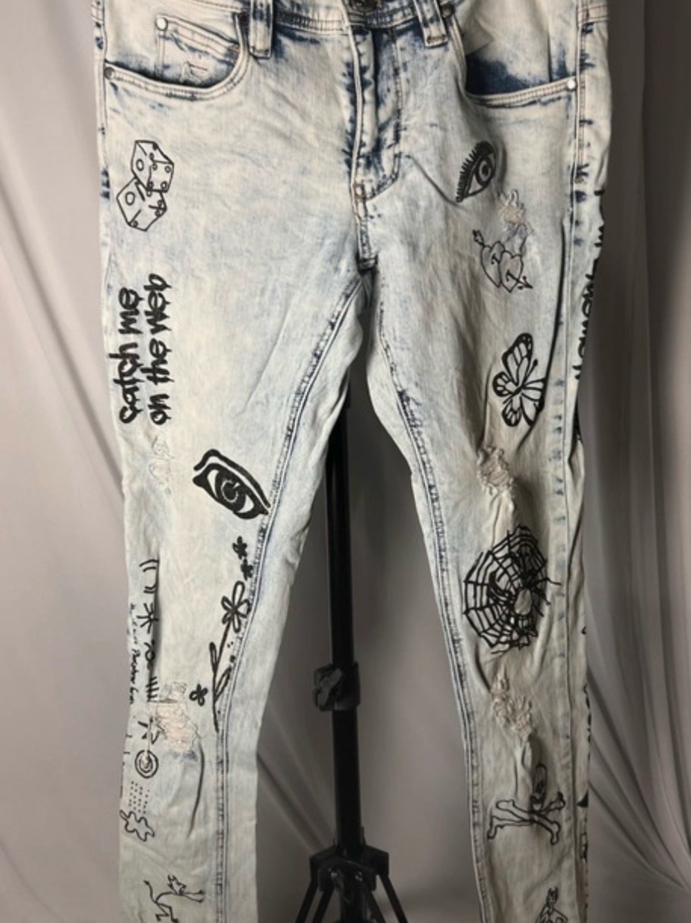 Rogue Light Wash Skinny Jeans with Black Graphic Prints